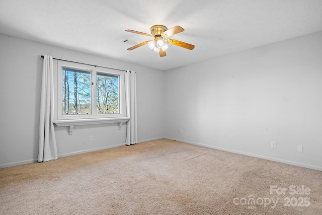 505 Victory Trl, Morganton, NC 28655 - carpeted spare room with baseboards, a ceiling fan, and visible vents