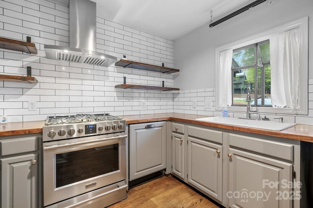 505 Victory Trl, Morganton, NC 28655 - kitchen featuring gas stove, open shelves, butcher block counters, decorative backsplash, and range hood