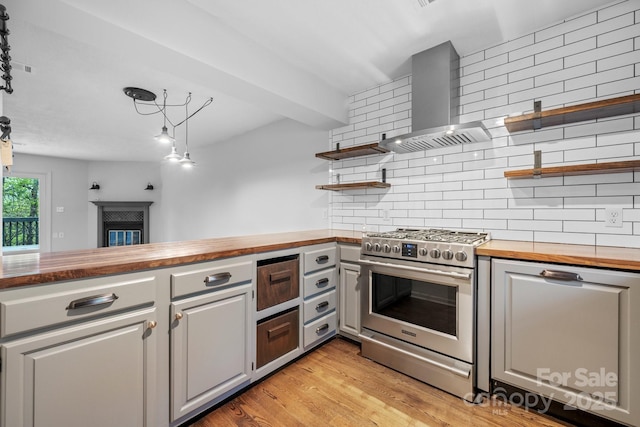 505 Victory Trl, Morganton, NC 28655 - kitchen with wall chimney exhaust hood, open shelves, gas range, wooden counters, and backsplash