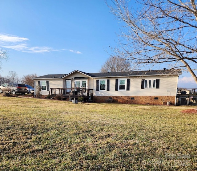 view of front of house with a deck, a front yard, and crawl space