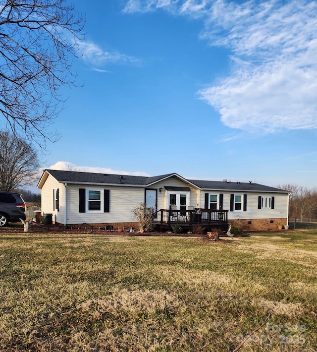 view of front of home with crawl space, a wooden deck, and a front lawn