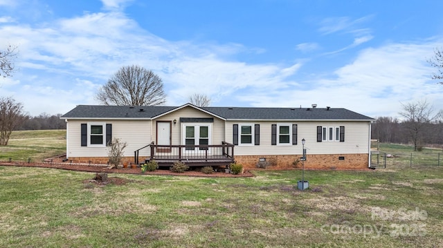 manufactured / mobile home featuring crawl space, a wooden deck, a front lawn, and a shingled roof