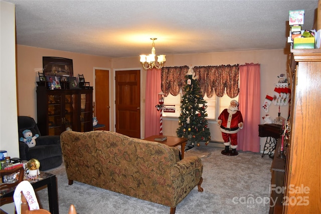 carpeted living room featuring an inviting chandelier and a textured ceiling