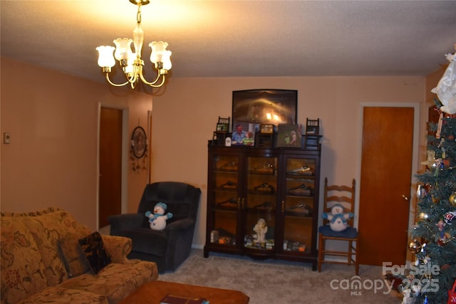 living room with carpet floors and an inviting chandelier