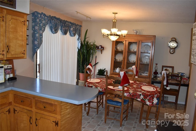 dining room with a notable chandelier