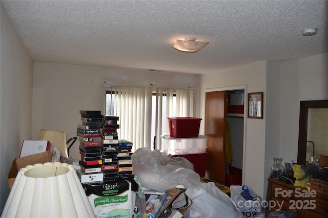 bedroom featuring a closet and a textured ceiling