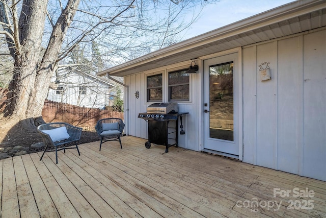 wooden terrace featuring area for grilling