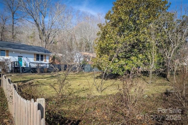 view of yard featuring a wooden deck