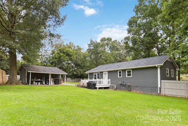 107 Deese Ct, Indian Trail, NC 28079 - rear view of property with crawl space, central AC unit, a deck, and an outbuilding