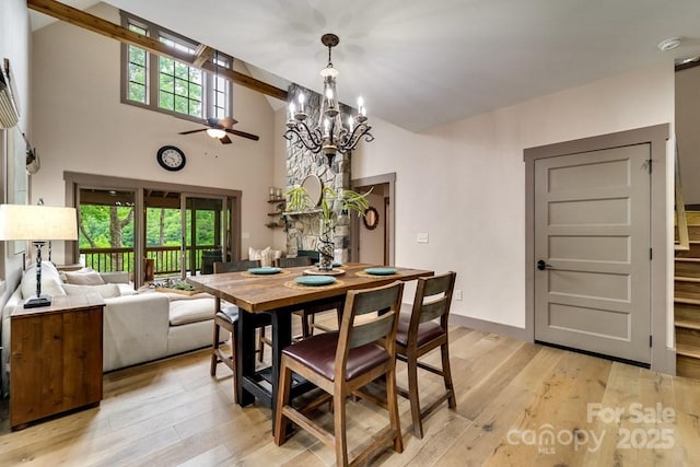 dining area featuring plenty of natural light, beam ceiling, and light hardwood / wood-style flooring