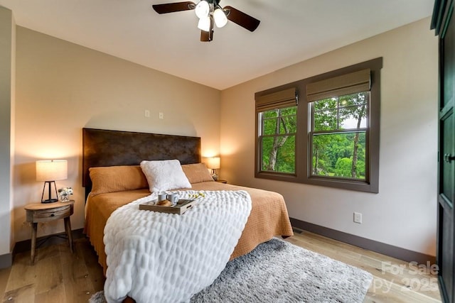 bedroom featuring ceiling fan and light wood-type flooring