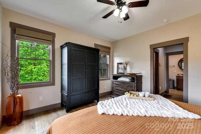 bedroom with ceiling fan and wood-type flooring