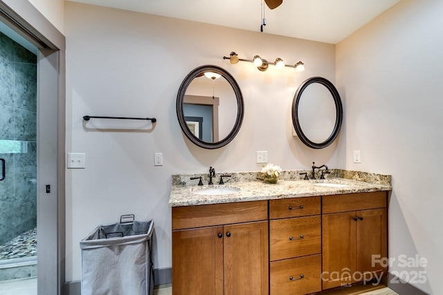 bathroom with an enclosed shower and vanity