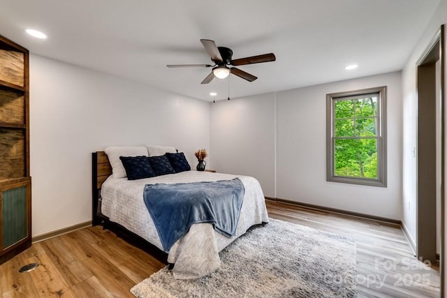 bedroom featuring ceiling fan and light wood-type flooring