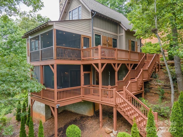 rear view of property featuring a sunroom