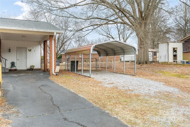 exterior space featuring central AC unit and a carport