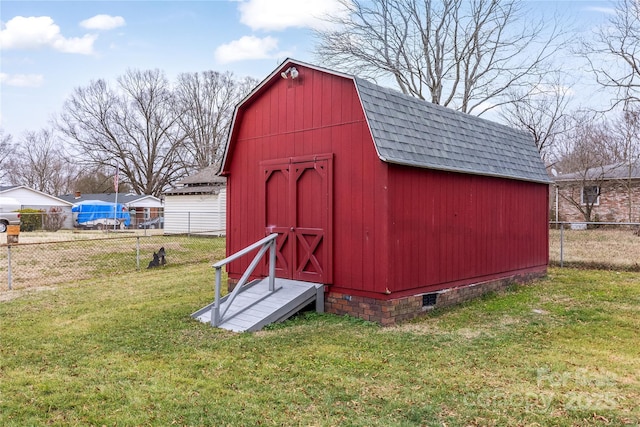 view of outdoor structure with a lawn