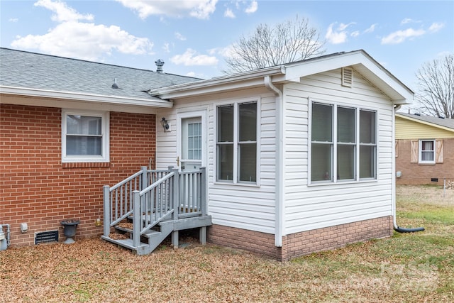 view of property exterior with a lawn