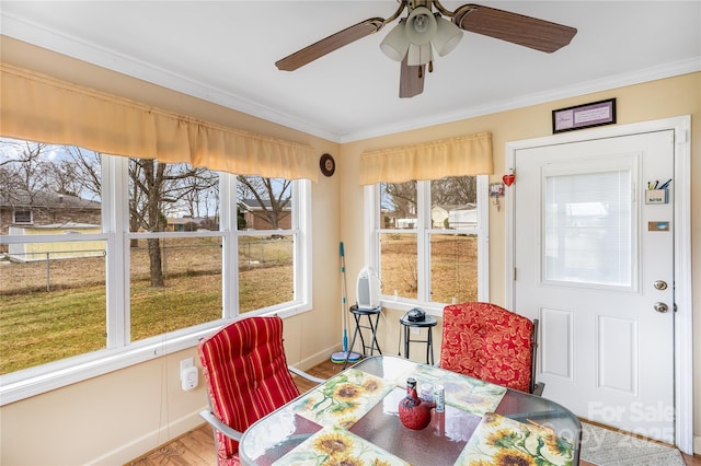 sunroom with ceiling fan