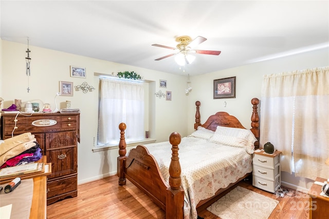 bedroom featuring light hardwood / wood-style floors and ceiling fan