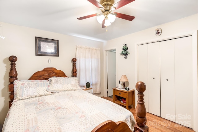 bedroom featuring ceiling fan, light hardwood / wood-style floors, and a closet