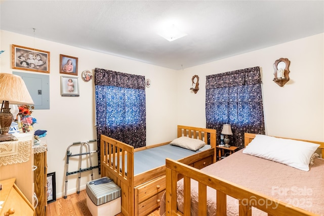 bedroom with wood-type flooring