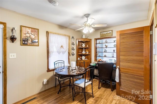 dining space featuring ceiling fan and light hardwood / wood-style flooring