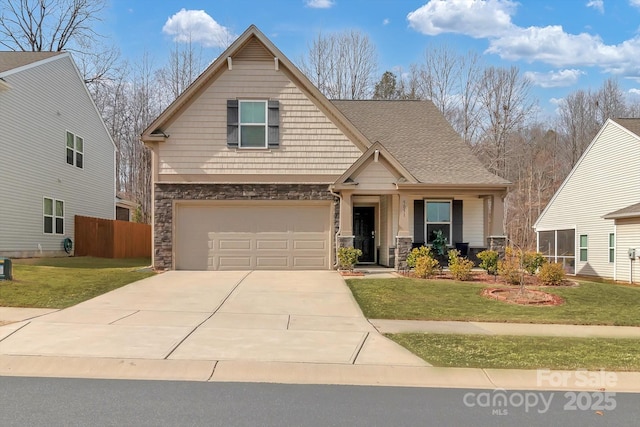 craftsman inspired home featuring a front lawn, a garage, and a porch