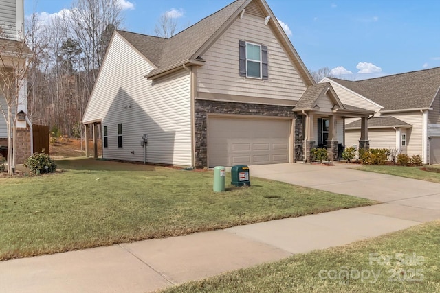 view of front of house with a front yard and a garage