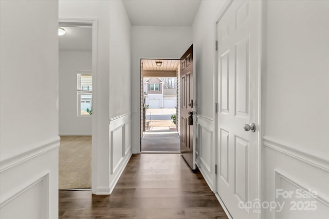 hallway featuring dark hardwood / wood-style flooring