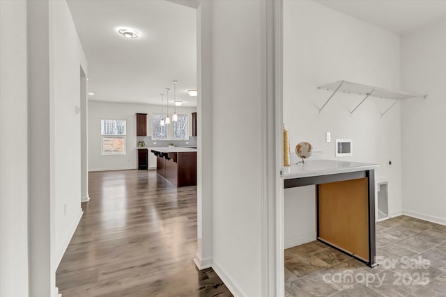 interior space with an inviting chandelier and light hardwood / wood-style flooring