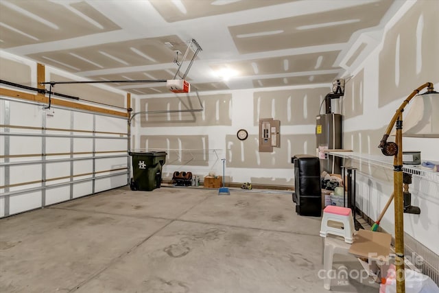 garage with electric panel, water heater, and a garage door opener