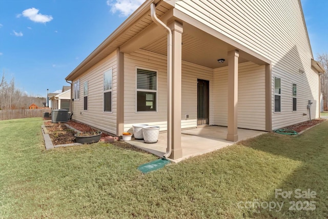 back of property featuring a yard and a patio