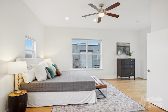 bedroom featuring ceiling fan and light hardwood / wood-style flooring