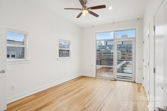 empty room featuring light hardwood / wood-style flooring and ceiling fan