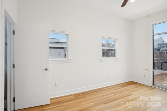 empty room featuring hardwood / wood-style flooring and ceiling fan