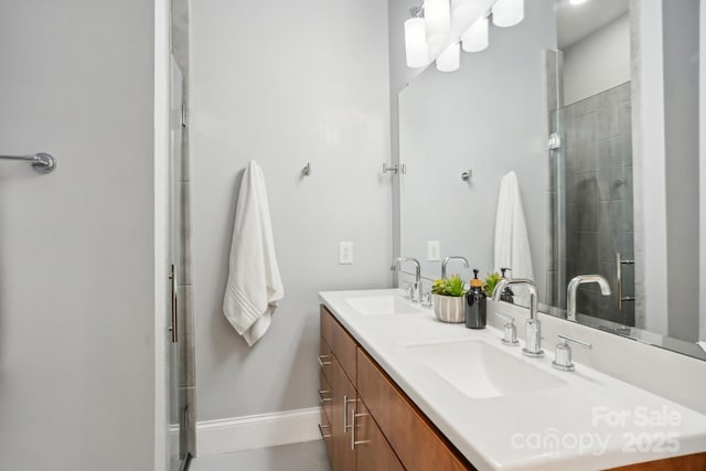 bathroom featuring vanity and an enclosed shower