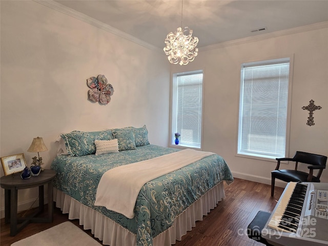 bedroom with crown molding, visible vents, wood finished floors, a chandelier, and baseboards