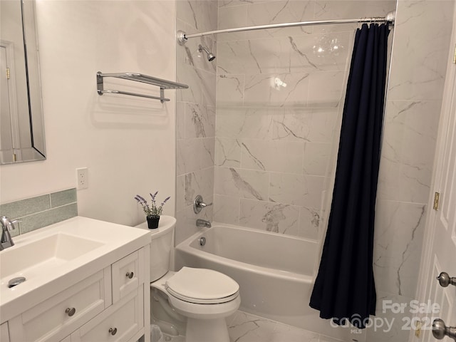 bathroom with marble finish floor, vanity, shower / bath combo with shower curtain, and toilet