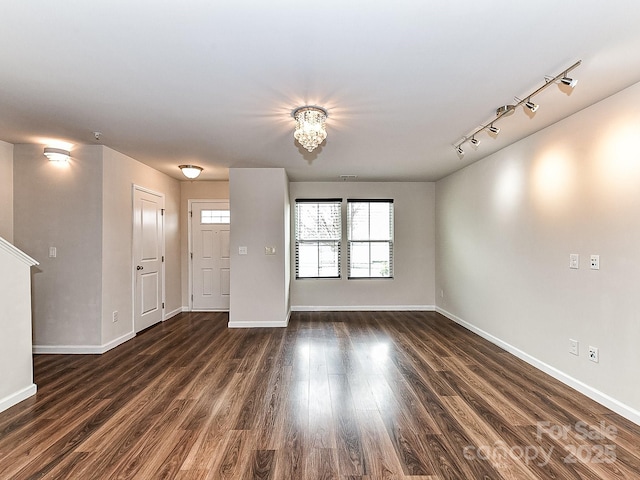 unfurnished living room with dark hardwood / wood-style flooring