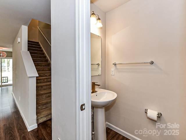 bathroom with wood-type flooring