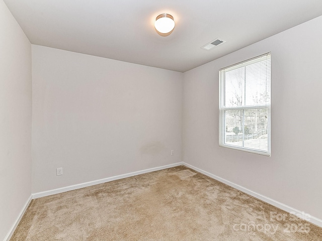 empty room with light colored carpet