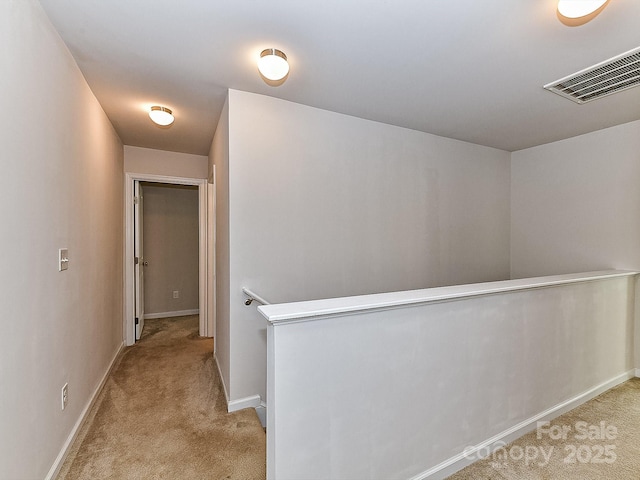 1128 Tangle Ridge Dr SE, Concord, NC 28025 - hallway with an upstairs landing and light carpet