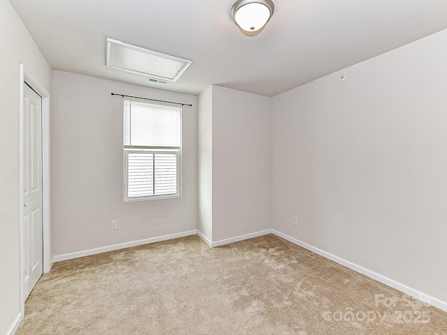 1128 Tangle Ridge Dr SE, Concord, NC 28025 - spare room featuring attic access and carpet floors