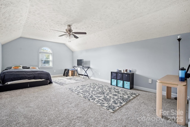 bedroom featuring vaulted ceiling, a textured ceiling, and carpet