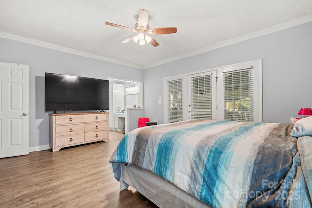 bedroom with hardwood / wood-style flooring, crown molding, access to exterior, and ceiling fan