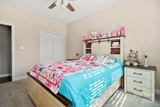 carpeted bedroom with ceiling fan and a closet