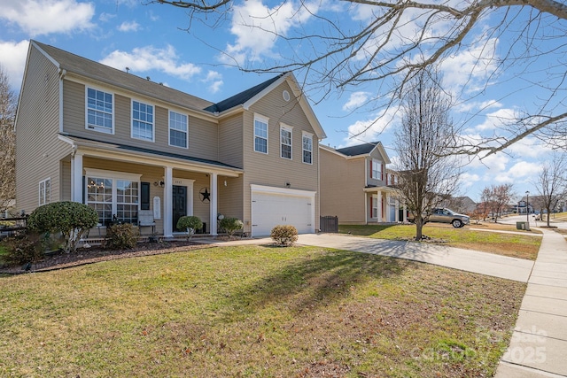 view of front of home featuring a porch, a garage, and a front yard