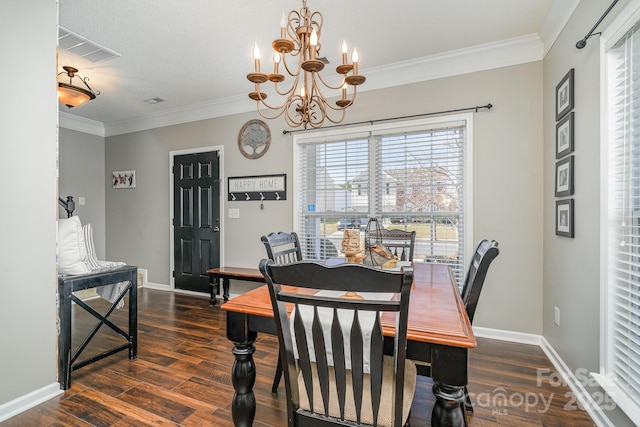 dining area featuring ornamental molding, dark hardwood / wood-style floors, and an inviting chandelier