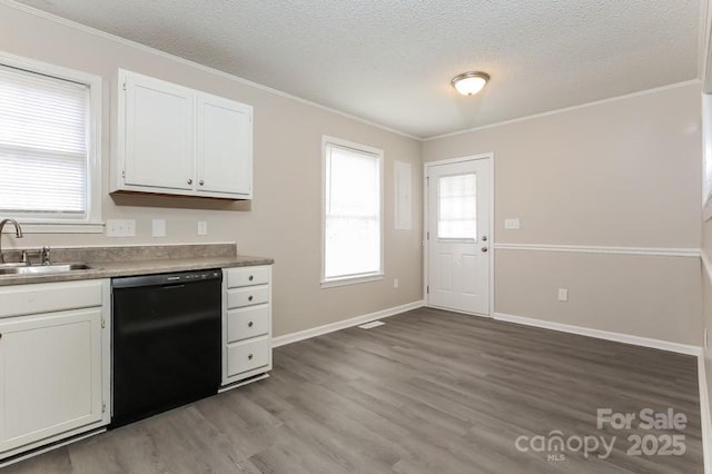 kitchen featuring sink, light wood-type flooring, ornamental molding, black dishwasher, and white cabinets